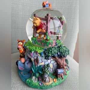 Disney’s Winnie the Pooh snow globe with music box.